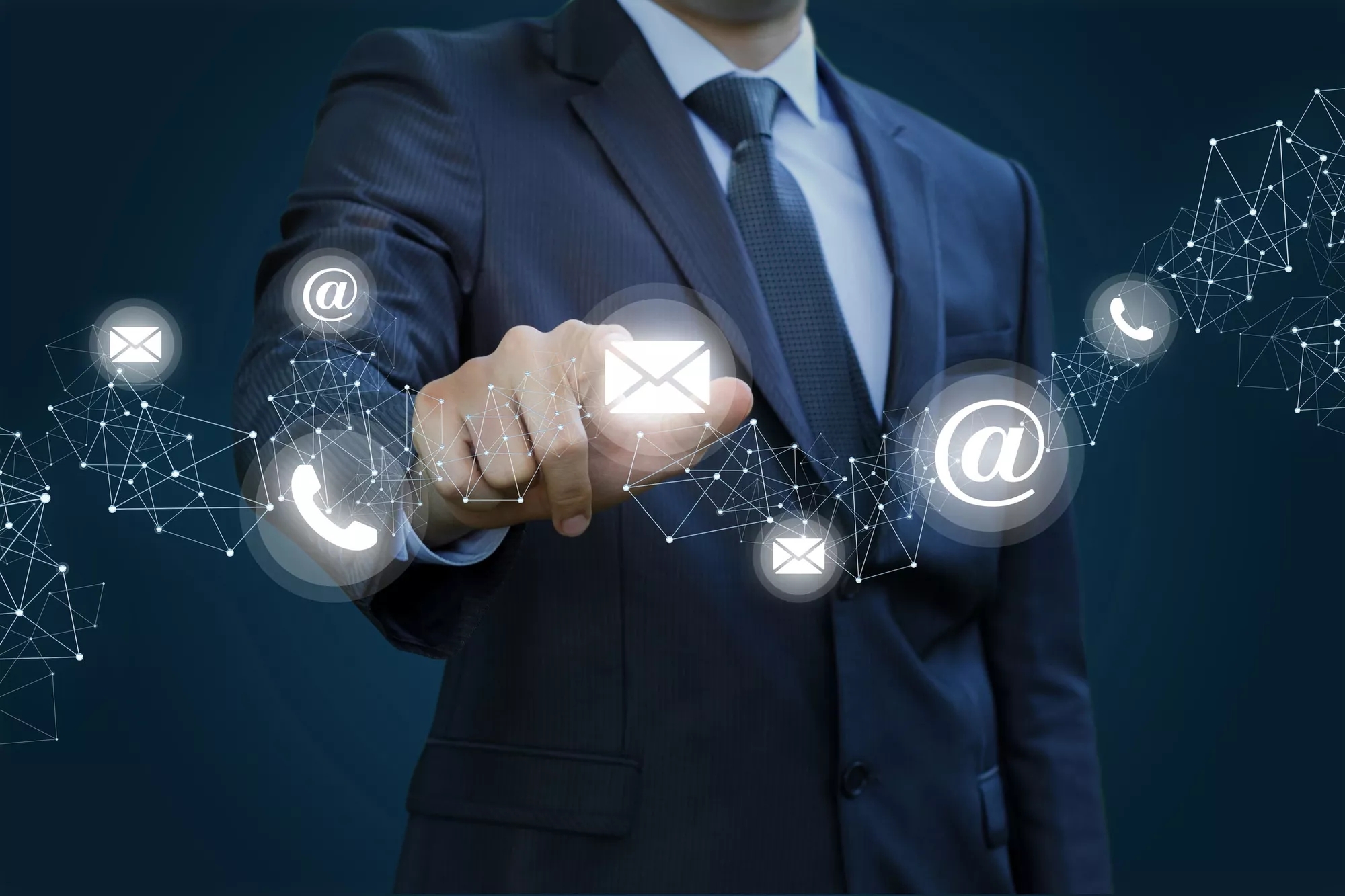 An image showing email, phone, internet connectivity signals in the front and person dressed up in blue suit in the background, An image showing email, phone, internet connectivity signals in the front and person dressed up in blue suit in the background,