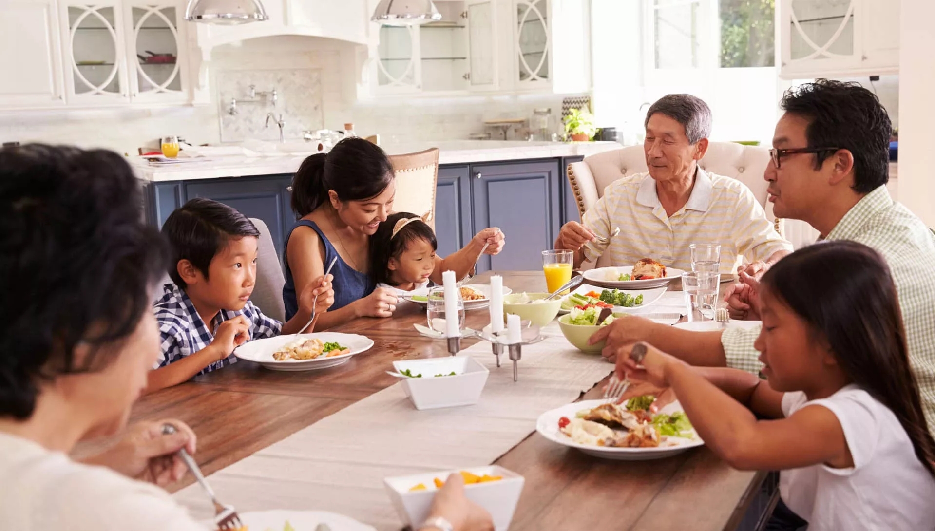 A Family having dinner together A Family having dinner together