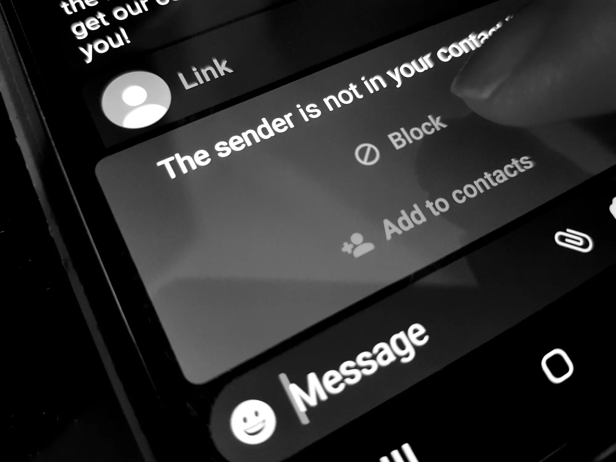 Suspicious text message on cell phone screen Suspicious text message on cell phone screen